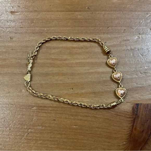 Beverly Hills Gold Jewelry - Beverly Hills Gold: 14k.Puffy triple heart rose gold, yellow gold rope bracelet.
